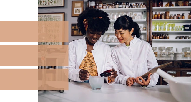 Two women scientists testing aromas.